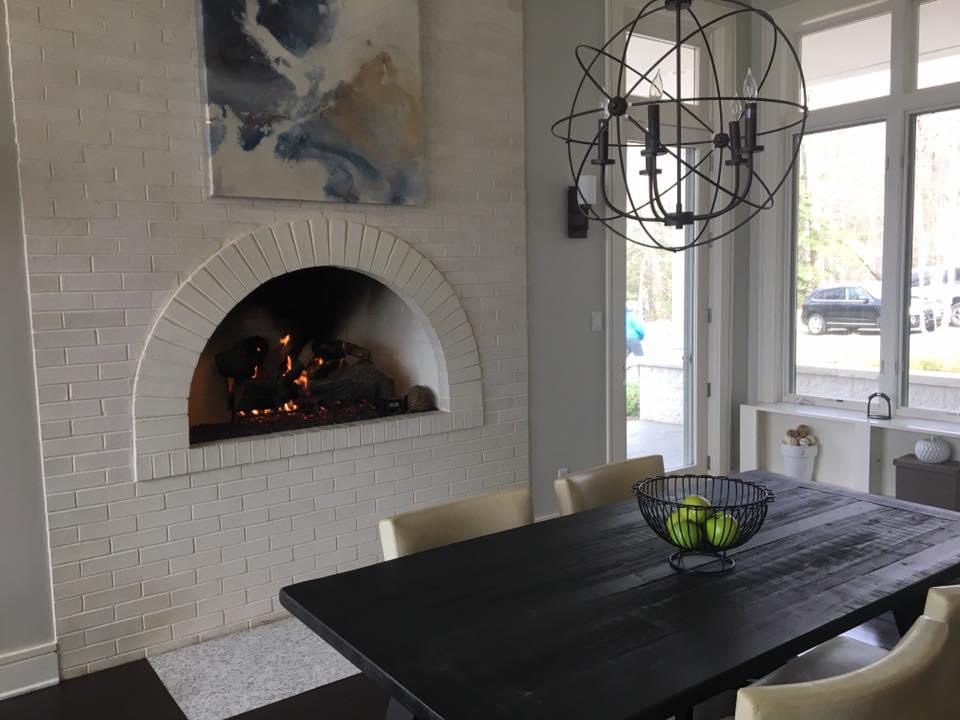 Open brick fireplace in a kitchen