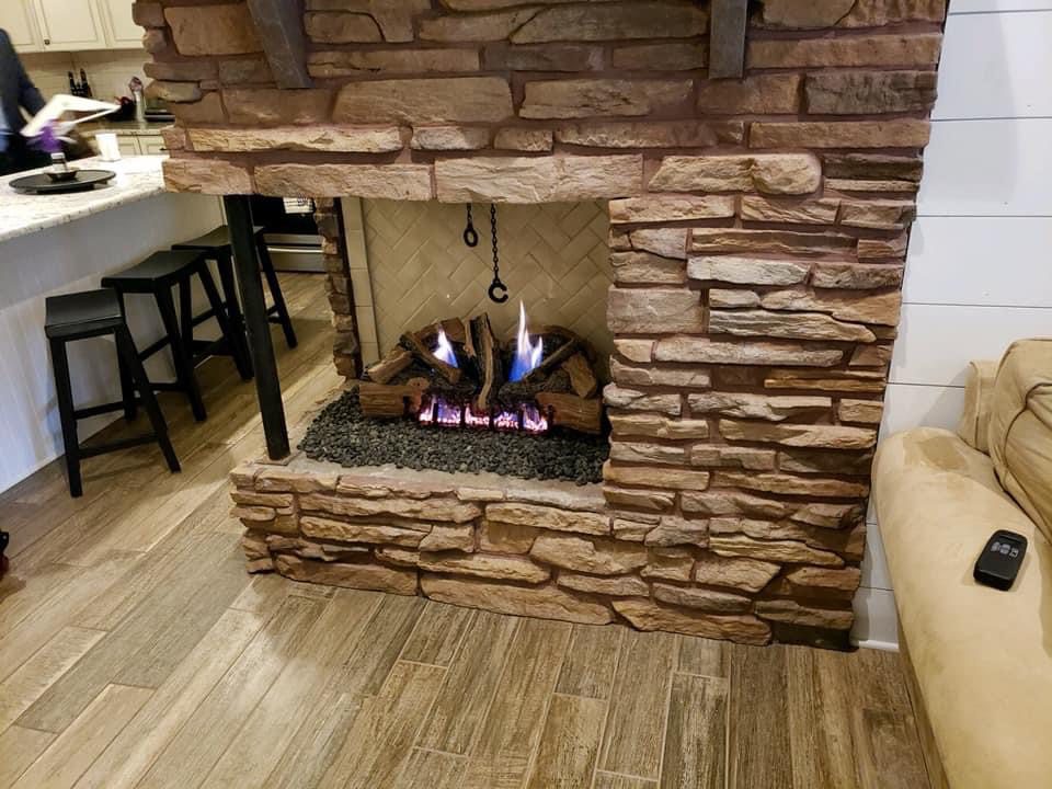 A fireplace with pebbles