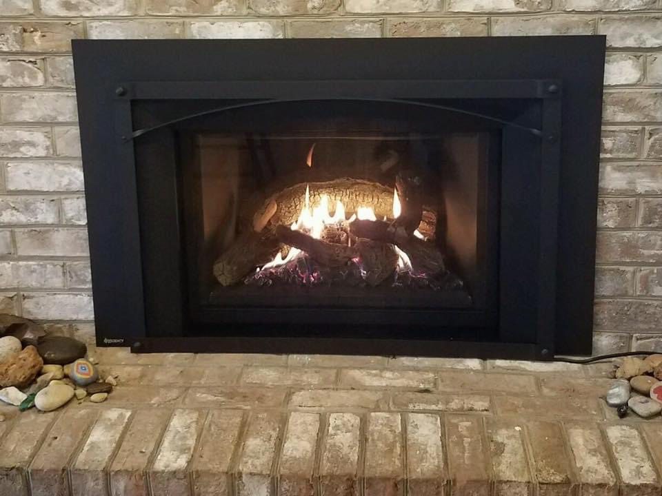 A fireplace with firewood